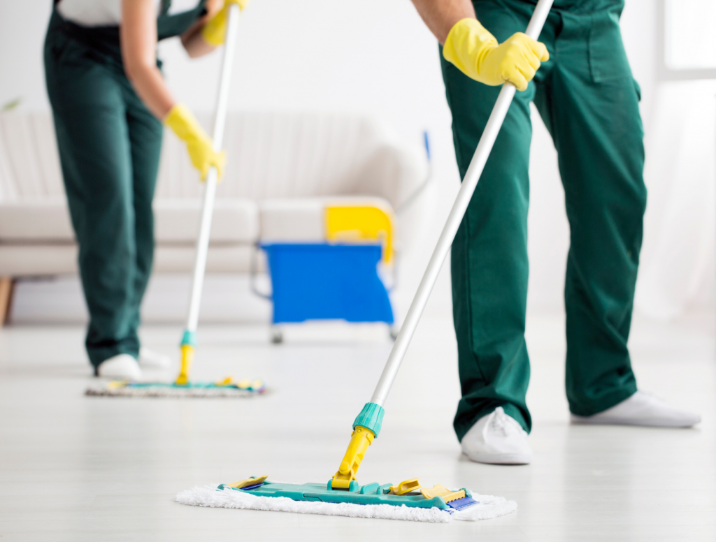 Professional cleaners mopping a holiday cottage floor in Alnwick